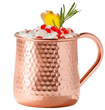 A copper mule mug holds a ice, pomegranate, and a rosemary sprig.