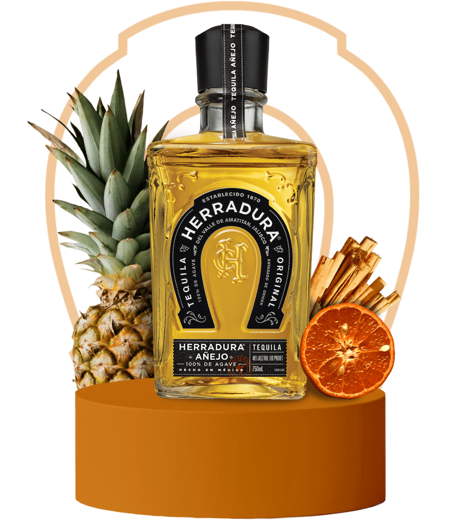 An image of a bottle of Herradura Anejo on an orange platform surrounded by flavor notes of pineapple, cinnamon, and dried citrus.