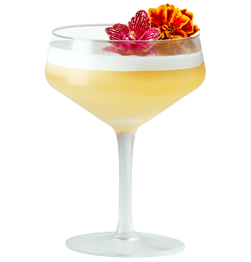 Yellow cocktail in a coupe glass garnished with flowers