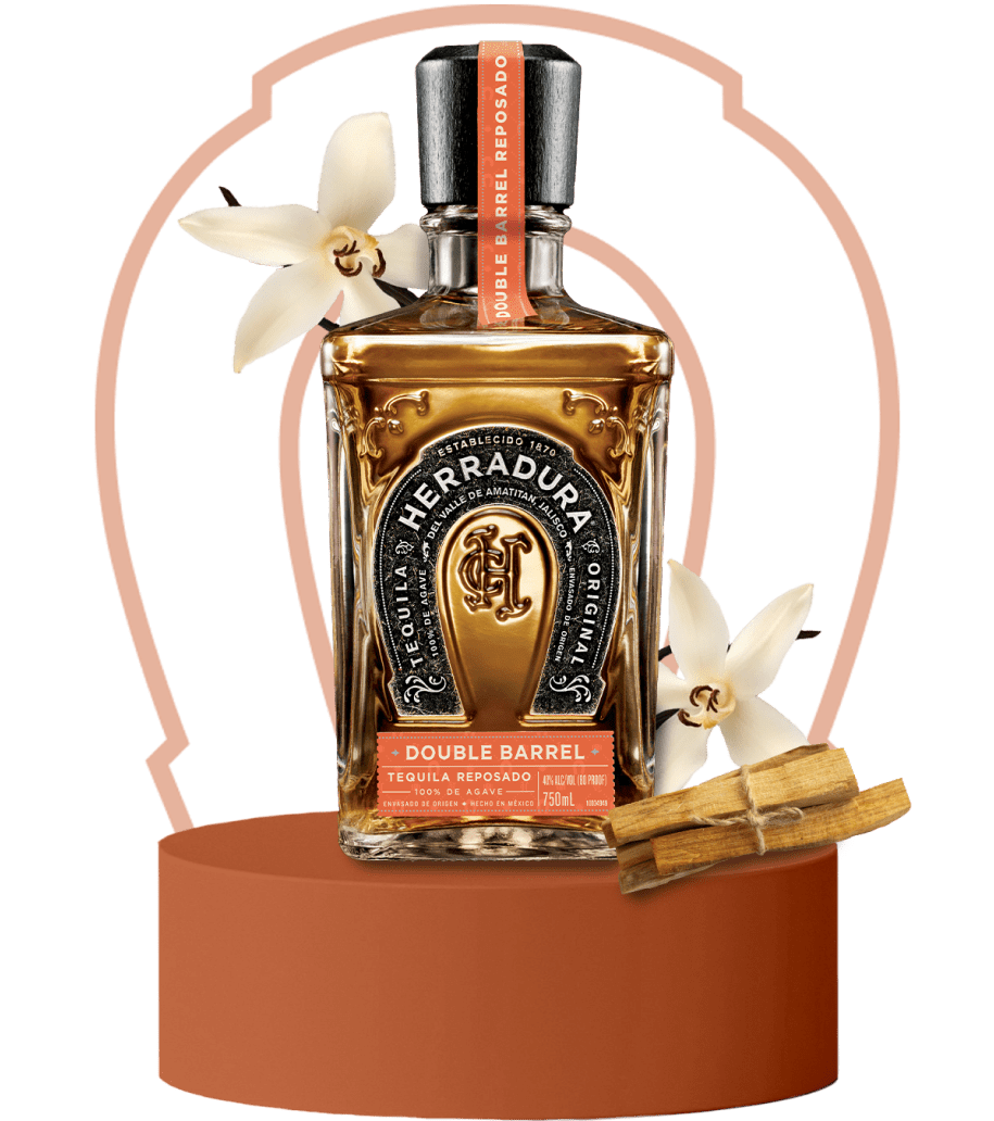 An image of a bottle of Herradura Double Barrel on a brown platform surrounded by flavor notes of vanilla and cinnamon.