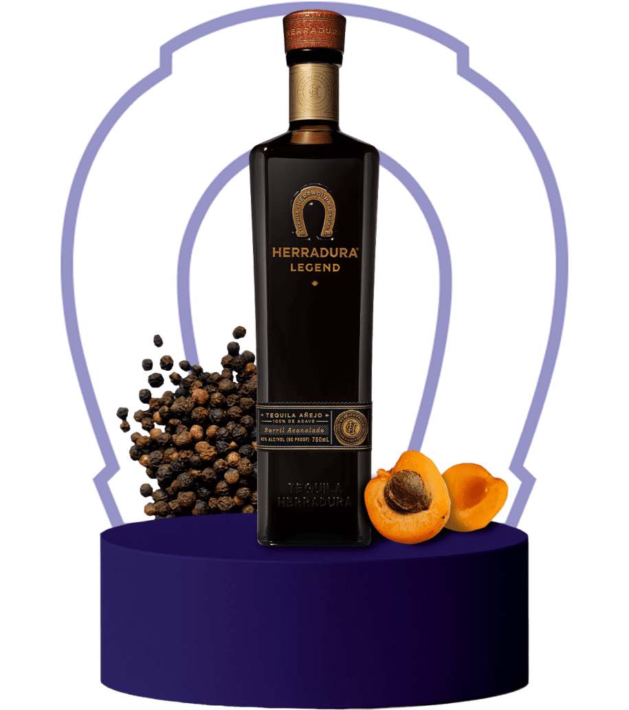 An image of a bottle of Herradura Legend on an indigo platform surrounded by flavor notes.