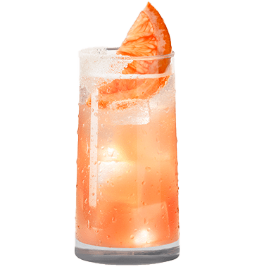 A pinkish orange Paloma in a tall glass with a grapefruit slice