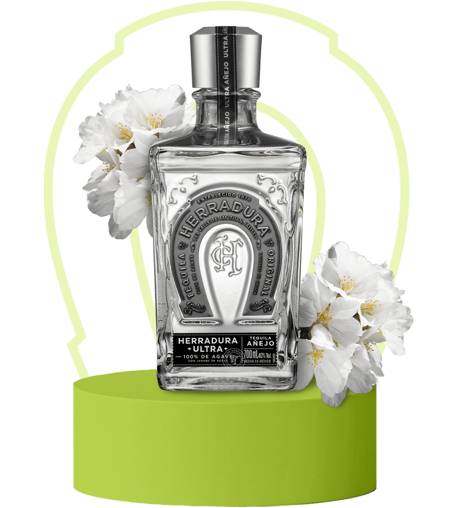 An image of a bottle of Herradura Ultra on lime green platform surrounded by flavor notes of vanilla.